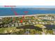 Breathtaking aerial view of waterfront property, showcasing beach access, lush landscaping, and scenic community at 3419 Myrtle St, Edisto Island, SC 29438