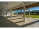 Open-air covered patio overlooking a serene waterway provides an idyllic outdoor living space at 3419 Myrtle St, Edisto Island, SC 29438