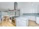 Spacious kitchen showcasing a center island with cooktop and stainless steel range at 3419 Myrtle St, Edisto Island, SC 29438