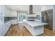 Open layout kitchen leading to a deck with outdoor access for seamless entertaining at 3419 Myrtle St, Edisto Island, SC 29438