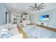 Comfortable living room featuring stylish furnishings, a ceiling fan, and an open floor plan at 3419 Myrtle St, Edisto Island, SC 29438
