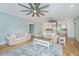 Bright, open-concept living room with a cozy seating area and an open floor plan at 3419 Myrtle St, Edisto Island, SC 29438