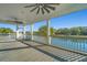 Spacious screened porch overlooking a serene body of water and lush green trees at 3419 Myrtle St, Edisto Island, SC 29438