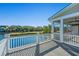 Peaceful outdoor porch overlooking calm lake with trees and greenery at 3419 Myrtle St, Edisto Island, SC 29438