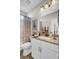 Well-lit bathroom with granite countertop vanity and a shower-tub combo at 345 Turnstone St, Mount Pleasant, SC 29464