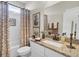 Cozy bathroom with a granite countertop vanity and a shower-tub combo at 345 Turnstone St, Mount Pleasant, SC 29464