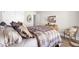 Comfortable bedroom with neutral walls and an ensuite bathroom at 345 Turnstone St, Mount Pleasant, SC 29464