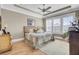 Cozy bedroom with tray ceilings, ceiling fan, neutral walls, and hardwood flooring at 345 Turnstone St, Mount Pleasant, SC 29464