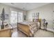 Charming bedroom with hardwood floors, ceiling fan, and bright natural lighting at 345 Turnstone St, Mount Pleasant, SC 29464