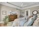 Bright bedroom with tray ceilings, neutral walls, and white painted trim throughout at 345 Turnstone St, Mount Pleasant, SC 29464