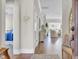 Inviting foyer with hardwood floors, molding, and entry to the living area at 345 Turnstone St, Mount Pleasant, SC 29464