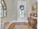 Bright foyer featuring hardwood flooring, detailed trim, and an exterior view at 345 Turnstone St, Mount Pleasant, SC 29464
