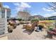 A charming brick patio with wicker furniture and lush landscaping offers a relaxing outdoor space at 345 Turnstone St, Mount Pleasant, SC 29464