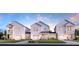 New construction homes featuring modern architecture, attached garages, well manicured lawns and beautiful landscaping at 396 Claret Cup Way, Charleston, SC 29414