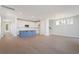 Bright living space with an open layout featuring hardwood floors, a blue island, and modern finishes at 396 Claret Cup Way, Charleston, SC 29414