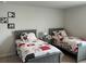 A bedroom with two twin beds, gray frames and Disney-themed bedding at 413 Cedarview Rd, Summerville, SC 29486