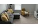 A living room with sectional couch, yellow accents, and a television at 413 Cedarview Rd, Summerville, SC 29486