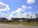A community pool area is framed against a picturesque sky, showing several seating areas and amenities for relaxation at 413 Cedarview Rd, Summerville, SC 29486