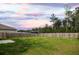Large fenced backyard and serene sunset at 436 Cedarview Rd, Summerville, SC 29486