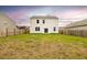 Large grassy backyard with a wood fence and a two-story house at 436 Cedarview Rd, Summerville, SC 29486