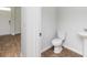A half bathroom featuring a pedestal sink and toilet at 436 Cedarview Rd, Summerville, SC 29486