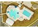 Overhead shot of a modern community pool area featuring a water slide, splash pad, lap pool, and numerous lounging options at 436 Cedarview Rd, Summerville, SC 29486