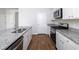 A stylish kitchen features granite countertops, stainless steel appliances, and white cabinets at 436 Cedarview Rd, Summerville, SC 29486