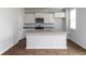 Bright kitchen features an island, granite countertops, stainless appliances, and ample storage space at 436 Cedarview Rd, Summerville, SC 29486