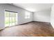 Light-filled living room showcases beautiful wood-look floors and a sliding door to outdoor area at 436 Cedarview Rd, Summerville, SC 29486
