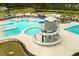 Aerial view of a luxurious community pool with a unique water slide feature, lap lanes, and ample lounging space at 436 Cedarview Rd, Summerville, SC 29486