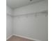 Carpeted walk-in closet featuring multiple shelves for ample storage at 436 Cedarview Rd, Summerville, SC 29486