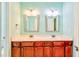 Bathroom featuring double vanity, with individual mirrors at 4846 Causey Pond Rd, Awendaw, SC 29429