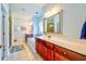 Bright primary bathroom featuring double vanity, soaking tub, and separate walk-in shower at 4846 Causey Pond Rd, Awendaw, SC 29429