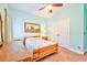 Bedroom with two closets, pale blue walls, ceiling fan, carpet, and natural light at 4846 Causey Pond Rd, Awendaw, SC 29429