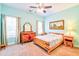 Bedroom featuring pale blue walls, ceiling fan, carpet, and natural light at 4846 Causey Pond Rd, Awendaw, SC 29429