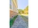 A stone walkway runs along the side of this home with stone accents and a manicured lawn at 4846 Causey Pond Rd, Awendaw, SC 29429