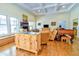 Spacious living room featuring hardwood floors, a stone fireplace, and natural light at 4846 Causey Pond Rd, Awendaw, SC 29429