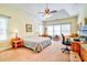 Spacious main bedroom featuring a ceiling fan and large windows at 4846 Causey Pond Rd, Awendaw, SC 29429