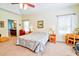 Bright main bedroom featuring large windows and ensuite bathroom at 4846 Causey Pond Rd, Awendaw, SC 29429
