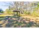 Park-like yard with swing set; a peaceful retreat with plenty of seating at 4846 Causey Pond Rd, Awendaw, SC 29429