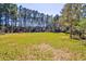 Expansive green yard; ideal for outdoor activities and enjoying nature at 4846 Causey Pond Rd, Awendaw, SC 29429
