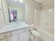 Bright bathroom featuring a white vanity with a marble countertop and a shower-tub combination at 609 Sienna Way, Summerville, SC 29486