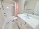 Neat bathroom featuring a shower-tub combination, a white vanity with chrome hardware, and floral decor at 609 Sienna Way, Summerville, SC 29486