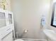 Cozy half-bath with white vanity, vessel sink, decorative mirror and towel ring at 609 Sienna Way, Summerville, SC 29486