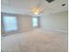 Spacious carpeted bedroom with a ceiling fan and plenty of natural light at 609 Sienna Way, Summerville, SC 29486