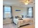 Comfortable bedroom with soft carpet, bright windows and ceiling fan at 609 Sienna Way, Summerville, SC 29486