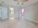 Neutral carpeted bedroom leads to adjacent bathroom and closet spaces at 609 Sienna Way, Summerville, SC 29486