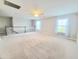 Spacious bonus room with neutral carpet, plenty of windows and ceiling fan at 609 Sienna Way, Summerville, SC 29486