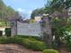 The Hammocks community sign with beautiful landscaping and brick columns at 609 Sienna Way, Summerville, SC 29486