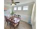 Light and airy dining room featuring three windows, classic furniture and modern ceiling fan at 609 Sienna Way, Summerville, SC 29486